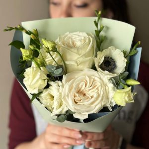 Elegant floral arrangement: Roses, Lisianthus, Anemones, Greens