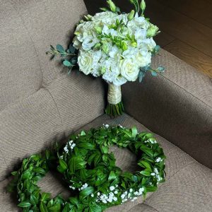Wedding Bouquets: Roses, Freesia, Lisianthus, Eucalyptus. Wreaths: Barvink, Gypsophila.