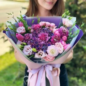 "Enchanted Blooms Symphony" bouquet featuring hydrangeas, dahlias, lisianthus, dianthus, scabiosa, tulips, and spray roses.