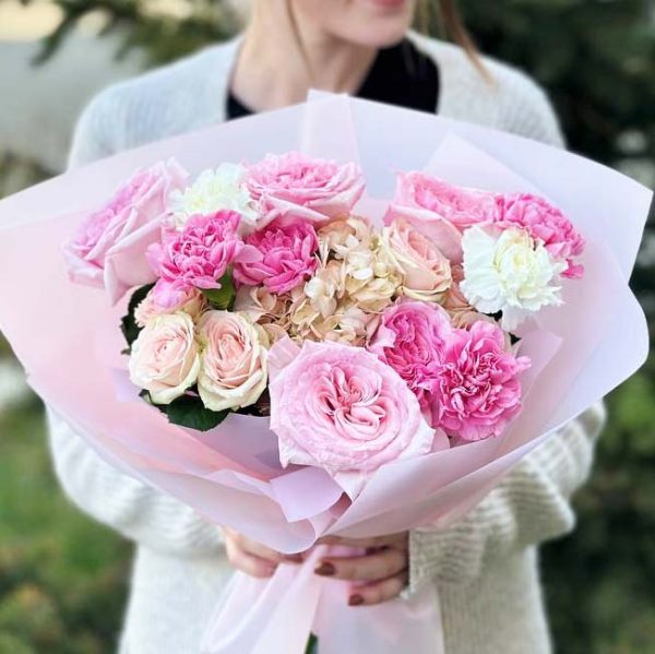 "Harmony in Bloom" bouquet showcases hydrangeas, spray roses, roses, and dianthus, creating a harmonious blend of elegance and charm.