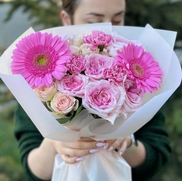 A beautiful bouquet featuring radiant roses and cheerful gerbera daisies. Perfect for gifting or decoration.