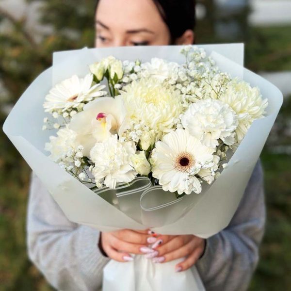 An enchanting bouquet featuring chrysanthemums, gerbera daisies, spray roses, and orchids. Ideal for special occasions and heartfelt gestures.