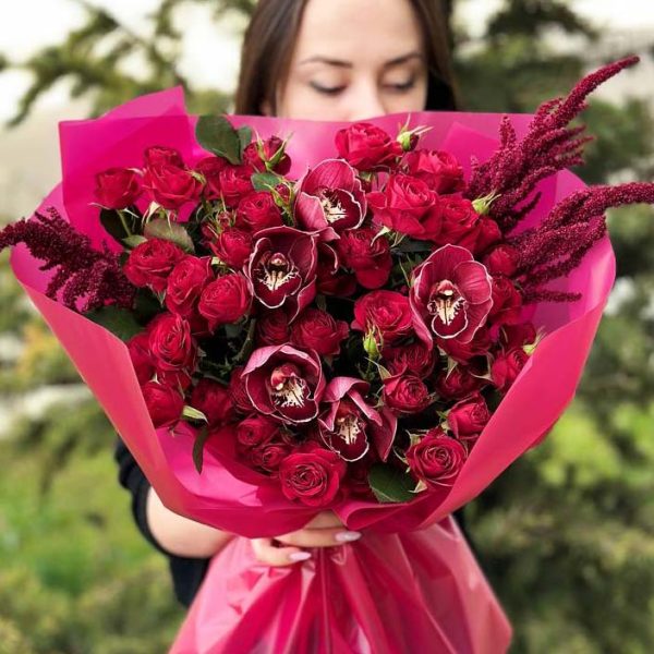 A stunning bouquet featuring spray roses and orchids, exuding timeless elegance and exotic charm.