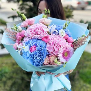 A close-up view of the Silva Pink Dreamscape bouquet, showcasing its Silva Pink hydrangeas, gerbera daisies, lisianthus, astilbe, irises, and ranunculus in all their exquisite beauty