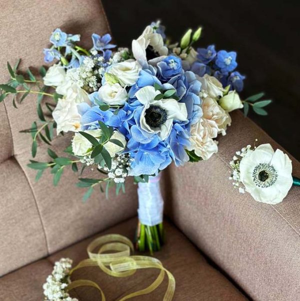 A comprehensive Bridal Bouquet Package featuring a stunning Bridal Bouquet, a charming Boutonniere, and a beautiful Floral Crown, perfect for your wedding day.
