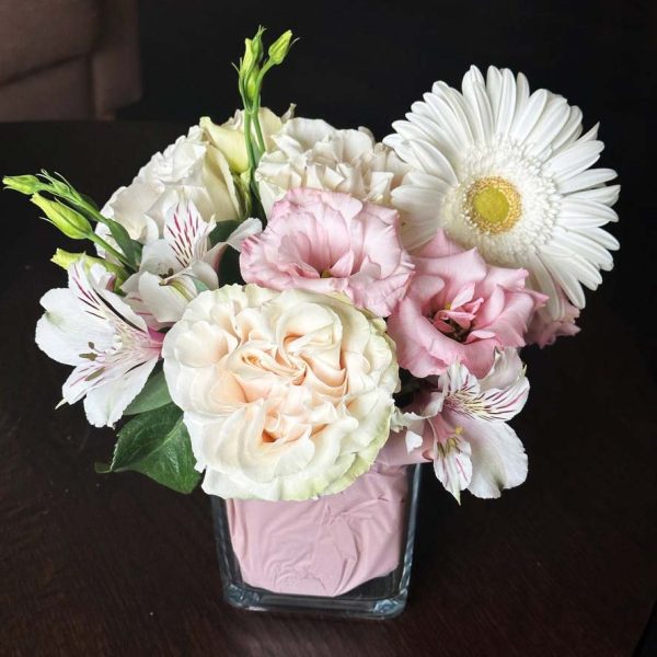 Elevate your home decor with our Graceful Flower Vase, featuring a lovely combination of roses, lisianthus, gerbera daisies, and astromeria. A beautiful addition to any living space.