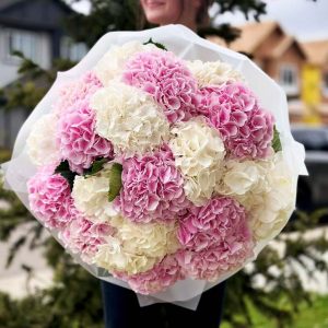 A serene bouquet featuring hydrangeas in soft, pastel hues, exuding tranquility and elegance.