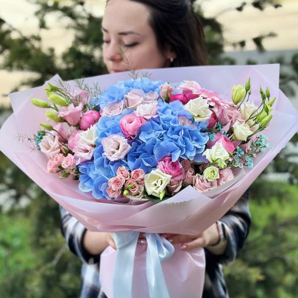 Alternative text for the image of the bouquet: "Bouquet featuring hydrangeas, gerberas, ranunculuses, spray roses, lisianthuses, and oxypetalum