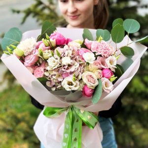 The 'Enchantment Bouquet' featuring hydrangeas, lisianthus, spray roses, eucalyptus, mini carnations, and dianthus—a captivating masterpiece.