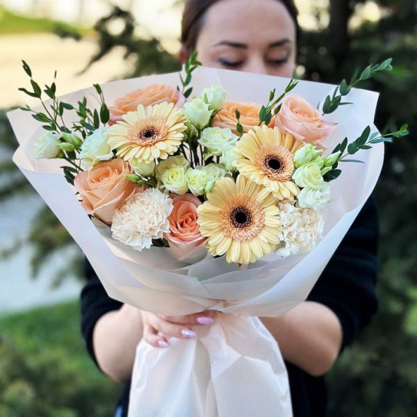 A beautiful image of the "Elegant Rose Garden" bouquet, showcasing the romantic allure of roses, the vibrancy of gerberas, and the delicate beauty of dianthus, accented by eucalyptus and lisianthus.