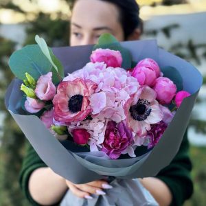 An elegant bouquet showcasing hydrangeas, lisianthus, dianthus, eucalyptus, and spray roses. Perfect for weddings, special occasions, or heartfelt gifts, radiating elegance and charm.