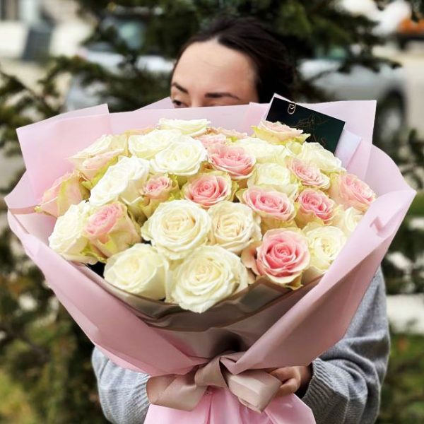The "Gentle Blush of Roses" bouquet showcases the tender beauty of white and pink roses, expressing love and appreciation.