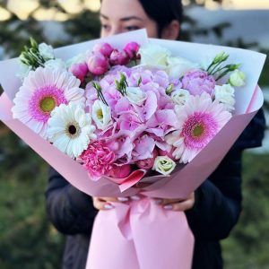 A lovely bouquet with hydrangeas, roses, gerberas, and other flowers, perfect for expressing love and admiration.