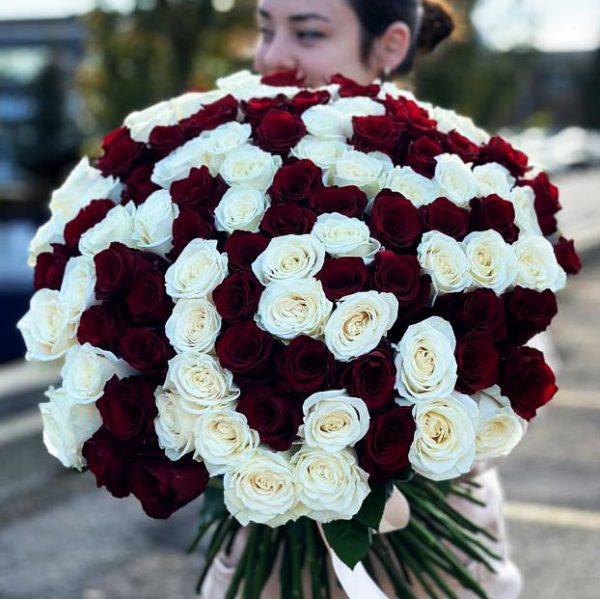 A stunning bouquet featuring a symphony of radiant roses, the perfect choice for expressing emotions with beauty and elegance.