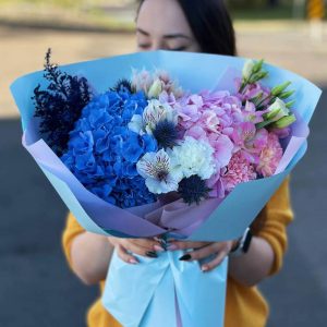 Image of the "Harmonious Meadow Symphony" bouquet featuring a delightful blend of hydrangeas, asters, astilbes, eryngium, sweet William, and lisianthus, inspired by nature's poetry. Perfect for captivating moments.