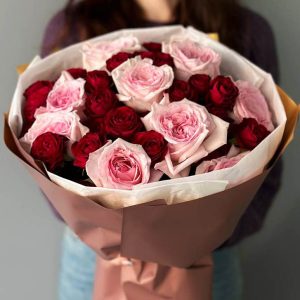 Image of the "Celestial Rose Cascade" bouquet, an elegant arrangement of white, pink, and crimson roses, ideal for romantic occasions and expressions of love and admiration.