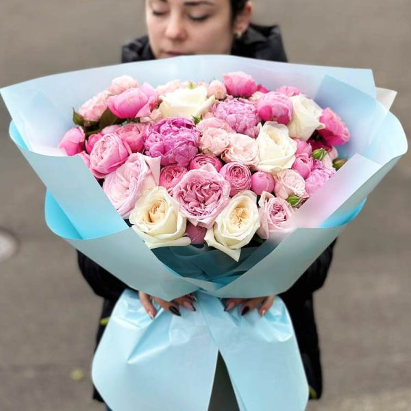 Image of the "Enchanting Peony Rose Medley" bouquet featuring lush peonies and delicate spray roses, perfect for romantic occasions.