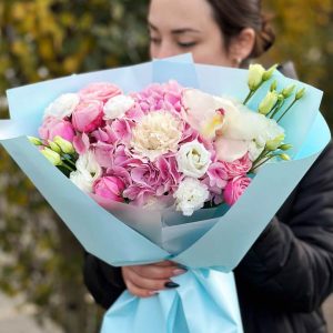 Image of the "Hydrangea Elegance" bouquet showcasing the beauty of hydrangeas, spray roses, lisianthus, orchids, and dianthus, an elegant choice for special occasions and celebrations.