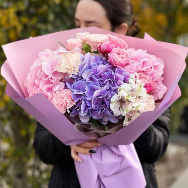Image of the "Garden Symphony" bouquet showcasing the beauty of hydrangeas, dianthus, astromeria, and spray roses, a serene and harmonious choice for expressing love and gratitude.