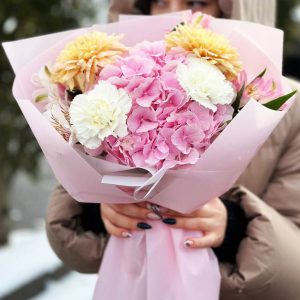 Image of the "Hydrangea Charm Bouquet" featuring hydrangeas, dianthus, chrysanthemums, and astromeria, a harmonious blend of classic and charming flowers, perfect for a versatile gift.