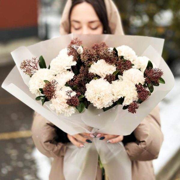 Image of the "Skimmia Delight" bouquet, featuring a vibrant mix of dianthus and skimmia, showcasing the contrasting textures and natural beauty that make it a versatile and delightful gift.