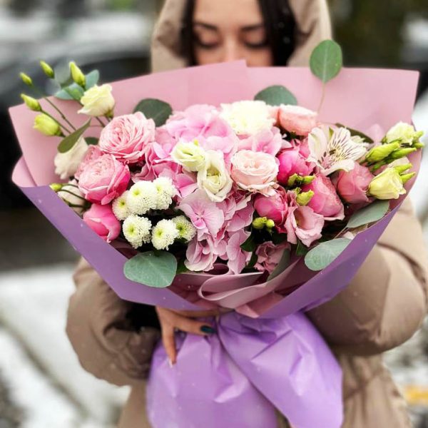 Image of the "Harmony in Bloom" bouquet, showcasing a harmonious blend of hydrangeas, spray roses, lisianthus, chrysanthemums, astromerias, eucalyptus, and dianthus, highlighting its elegant charm and soothing fragrance.