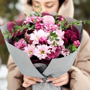 Image of the "Blooming Protea Harmony" bouquet, showcasing the exotic protea, delicate dianthus, lush chrysanthemums, fragrant eucalyptus, and playful berries, harmoniously arranged to create a visually appealing and balanced composition.