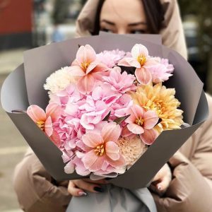 Image of the "Charming Garden Medley" bouquet showcasing hydrangeas, tulips, dianthus, and chrysanthemums – a symbol of garden-inspired elegance and joy.