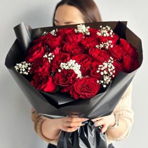 Image of the "Elegant Rose Whispers" bouquet, showcasing a beautiful combination of red and white roses with delicate gypsophila, symbolizing love and purity.