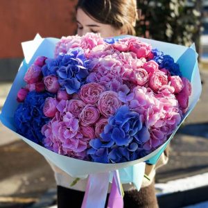 Image of the "Spray Roses and Hydrangea Harmony" bouquet, featuring delicate spray roses in various colors and lush, voluminous hydrangea blossoms, creating a harmonious and elegant floral arrangement.