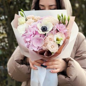 Image of the "Serenade of Hydrangeas and Spray Roses" bouquet, featuring hydrangeas, spray roses, dianthus, anemones, and lisianthus in a harmonious arrangement that speaks to the heart.