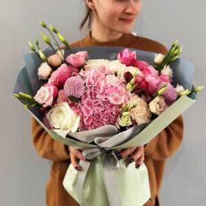 Image of the "Ethereal Blooms Harmony" bouquet, featuring a stunning arrangement of hydrangeas, roses, spray roses, dianthus, lisianthus, and chrysanthemums in a harmonious blend of soft pinks, creams, and greens.