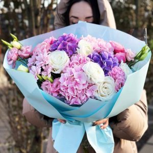 Image of the "Ethereal Garden Elegance" bouquet, showcasing a stunning arrangement of hydrangeas, ranunculuses, dianthus, chrysanthemums, roses, and lisianthuses. The varied colors and textures create an enchanting and sophisticated floral display.