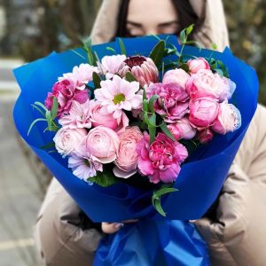 Image of the "Ethereal Elegance Bouquet," showcasing a captivating arrangement of protea, dianthuses, chrysanthemums, spray roses, and eucalyptus. The varied colors and textures create an ethereal and visually stunning floral ensemble.