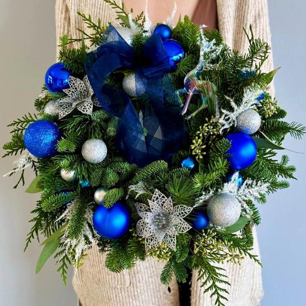 Blue Frost Delight: Handcrafted wreath with festive blue New Year's ornaments. A versatile and charming addition to your holiday decor, perfect for doors, walls, or mantels.