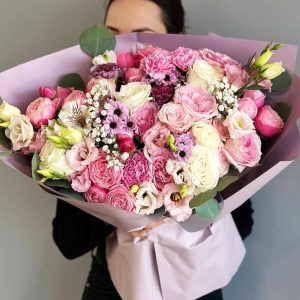 Subtle Hue: Bouquet with chrysanthemums, eucalyptus, spray roses, aster, and gypsophila, creating an impression of lightness and elegance.