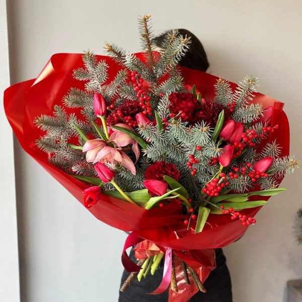 Festive Fusion: A lively arrangement with a Christmas tree, tulips, orchids, chrysanthemums, and ilex, creating a colorful and festive botanical display.