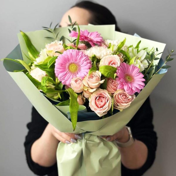 Spirited Blooms: A lively bouquet showcasing spray roses, gerberas, dianthus, aster, and ruscus, creating a dynamic and expressive floral arrangement.