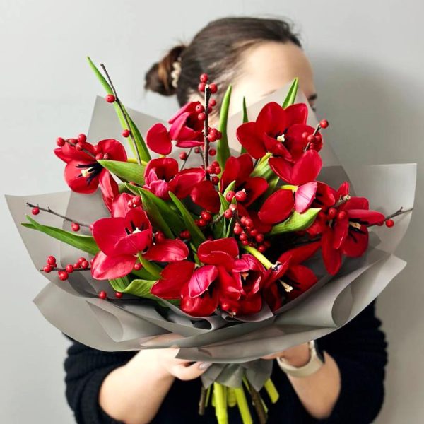 Tulip Elegance: A refined floral arrangement showcasing tulips and ilex, creating an elegant and timeless display.
