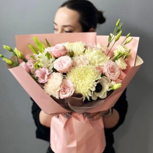 Blooms Symphony: A captivating bouquet showcasing chrysanthemums, anemones, lisianthus, aster, and spray roses, creating a harmonious and graceful floral arrangement.