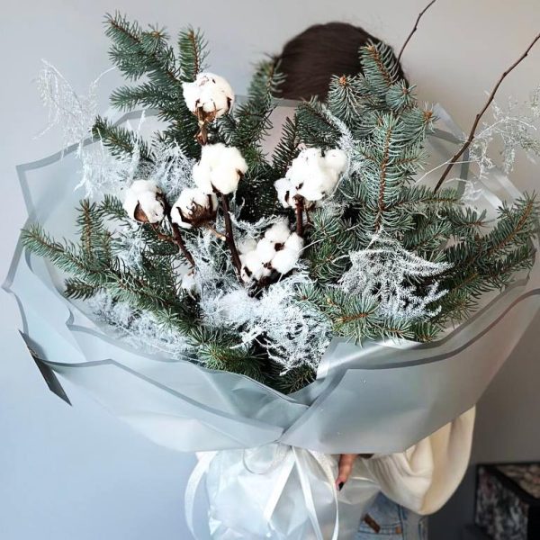 Cotton Whispers: A delightful arrangement showcasing cotton, asparagus, and pine, creating a cozy and rustic winter display.