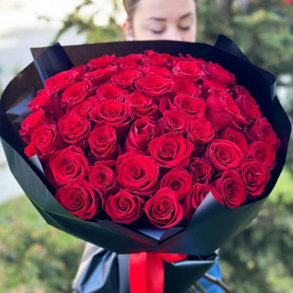 Grand Romance Bouquet: A luxurious arrangement showcasing 50 roses, creating a visual spectacle of deep affection and grandeur, perfect for momentous occasions or expressing unparalleled love.