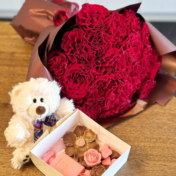 Valentine's Love Gift Set: An enchanting collection featuring decadent chocolates, a handcrafted bouquet, and an adorable teddy bear. The perfect expression of affection for Valentine's Day.