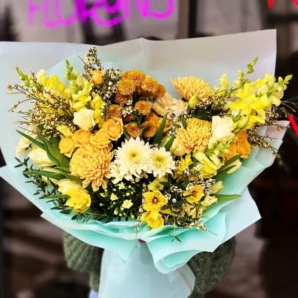 Spring Blossom Harmony Bouquet showcasing chrysanthemums, roses, tulips, daffodils, wax flowers, spray roses, lisianthus, kalanchoe, ginestra, hyacinths, and eucalyptus for a vibrant and aromatic display.