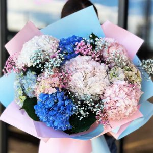 Whimsical Hydrangea Garden Bouquet showcasing lush hydrangeas and delicate gypsophila for a dreamy and enchanting display.