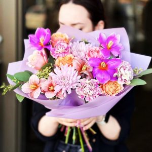 Spring Elegance Bouquet showcasing vibrant tulips, elegant chrysanthemums, charming dianthuses, luxurious roses, and aromatic eucalyptus for an elegant and sophisticated display.