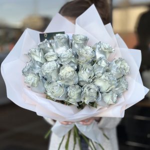 Discover timeless elegance with 'Silver Roses' bouquets. Adorned with delicate silver-hued blooms, these arrangements exude sophistication and grace. Perfect for commemorating special moments or expressing admiration, explore our collection and elevate your gifting experience. Order now to add a touch of refined beauty to any occasion.