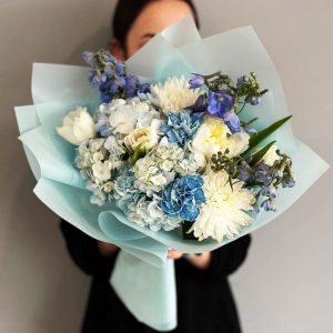 Spring Mood Bouquet showcasing hydrangeas, chrysanthemums, peonies, delphiniums, dianthuses, and tulips for a harmonious and vibrant display.