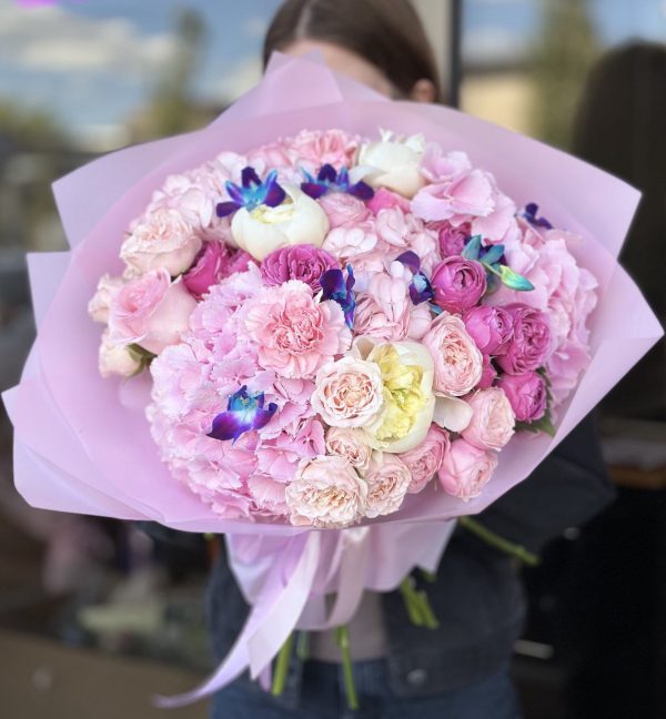 Image of 'Butterfly Touch' bouquet showcasing a charming blend of hydrangeas, dendrobium orchids, roses, spray roses, carnations, and peonies, evoking the graceful essence of a butterfly's touch.