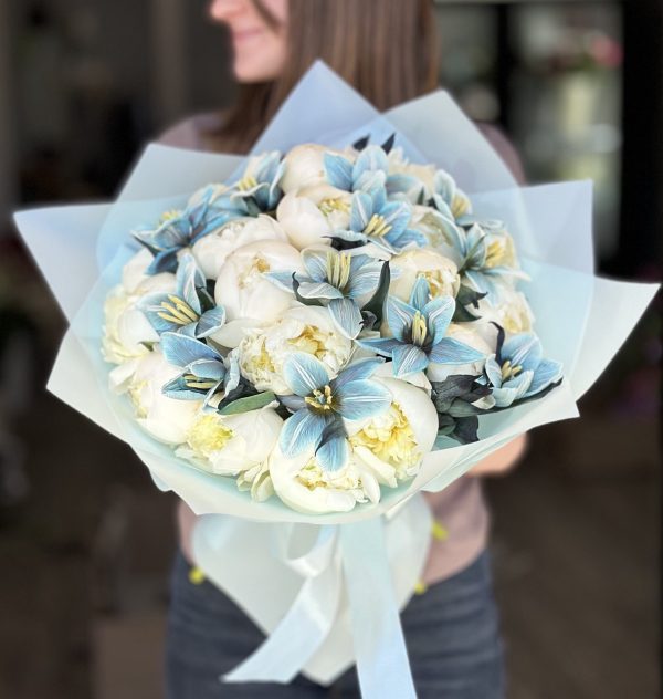 Image of 'Ocean of Love' bouquet showcasing beautiful blue tulips and elegant peonies, perfect for expressing heartfelt emotions on any occasion.